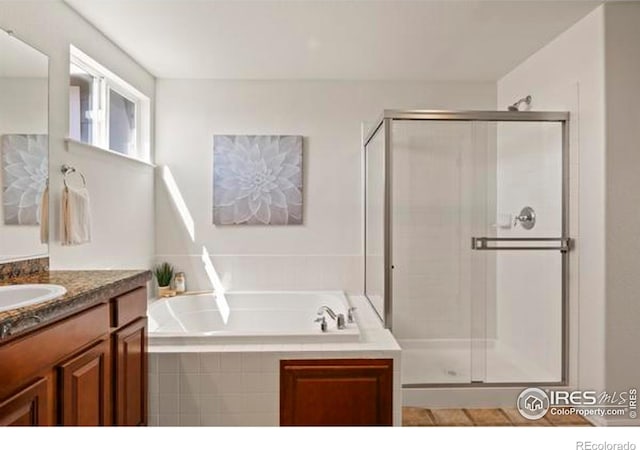 6117 Gold Dust Rd, Timnath, CO 80547 - full bathroom with a stall shower, vanity, and a garden tub