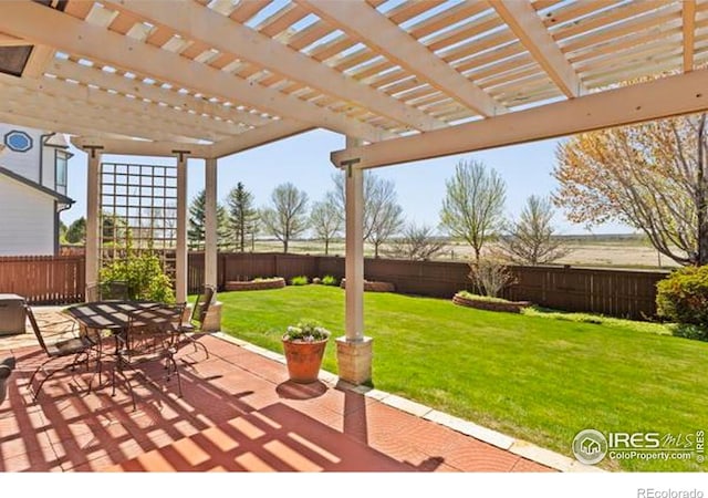 6117 Gold Dust Rd, Timnath, CO 80547 - fenced backyard featuring a patio, a pergola, and outdoor dining area