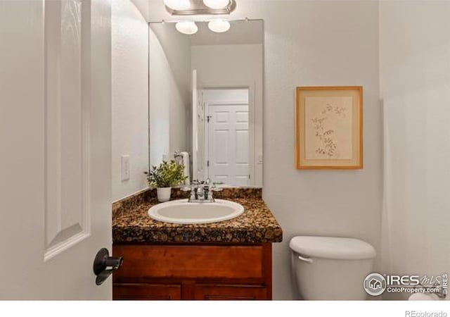 6117 Gold Dust Rd, Timnath, CO 80547 - bathroom featuring toilet and vanity