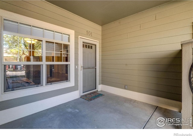 5775 29th St Unit 101, Greeley, CO 80634 - view of exterior entry featuring a patio