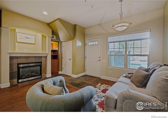 5775 29th St Unit 101, Greeley, CO 80634 - living area with visible vents, wood finished floors, a fireplace, baseboards, and recessed lighting