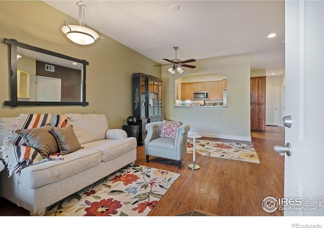 5775 29th St Unit 101, Greeley, CO 80634 - living area featuring a ceiling fan, baseboards, recessed lighting, wood finished floors, and visible vents