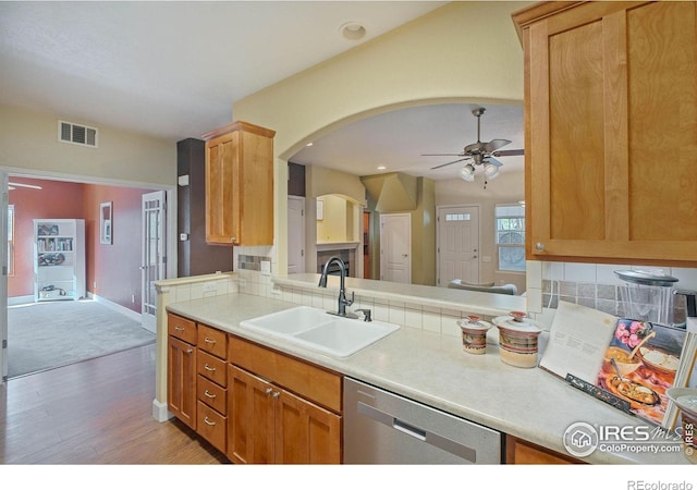5775 29th St Unit 101, Greeley, CO 80634 - kitchen featuring ceiling fan, visible vents, dishwasher, a sink, and light wood-style floors