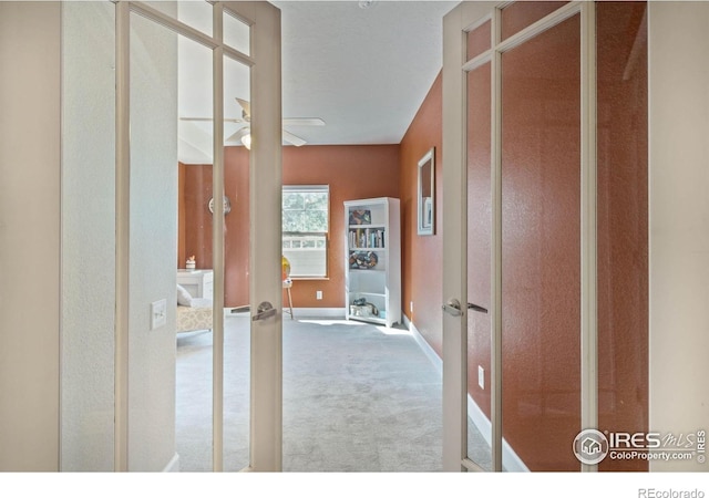 5775 29th St Unit 101, Greeley, CO 80634 - hallway featuring baseboards and carpet flooring