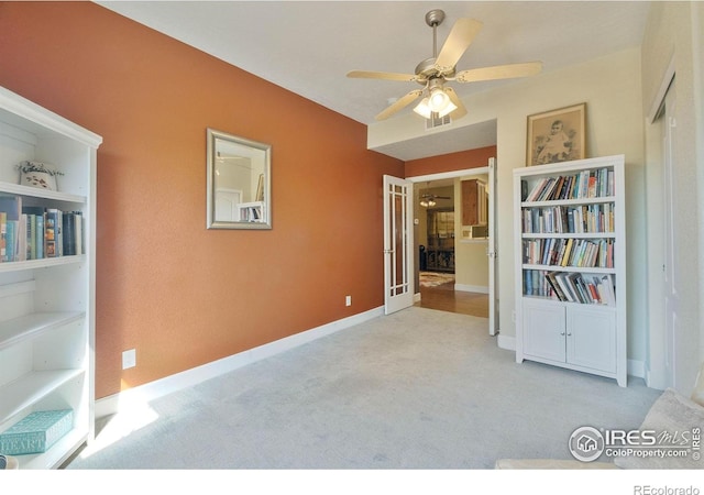 5775 29th St Unit 101, Greeley, CO 80634 - empty room with ceiling fan, visible vents, built in shelves, baseboards, and carpet