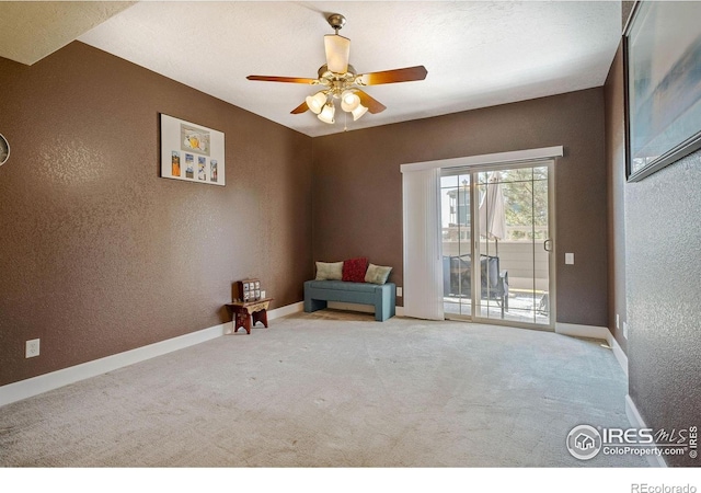 5775 29th St Unit 101, Greeley, CO 80634 - unfurnished room with ceiling fan, a textured wall, baseboards, and carpet