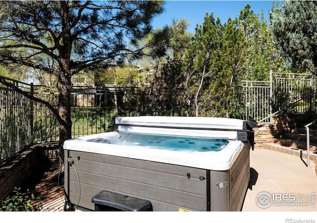 5775 29th St Unit 101, Greeley, CO 80634 - exterior space featuring a hot tub and fence