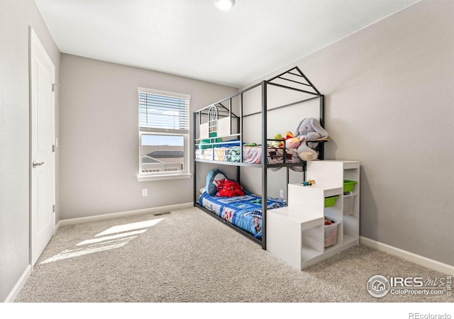 bedroom featuring carpet floors, baseboards, and visible vents