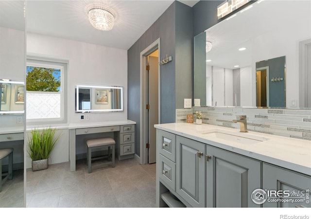 bathroom featuring vanity, decorative backsplash, and tile patterned flooring