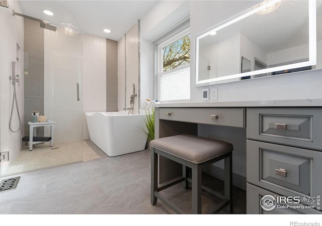 bathroom with recessed lighting, visible vents, tiled shower, tile patterned floors, and a freestanding bath