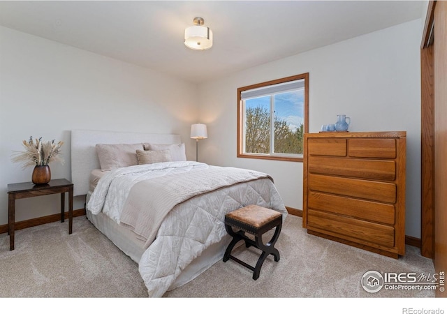 carpeted bedroom with baseboards