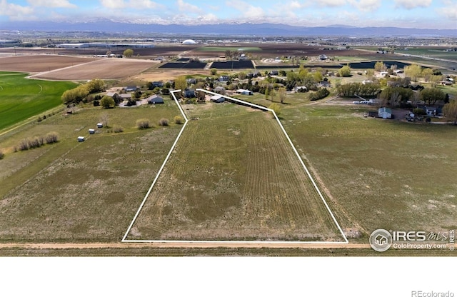 birds eye view of property featuring a rural view and a mountain view