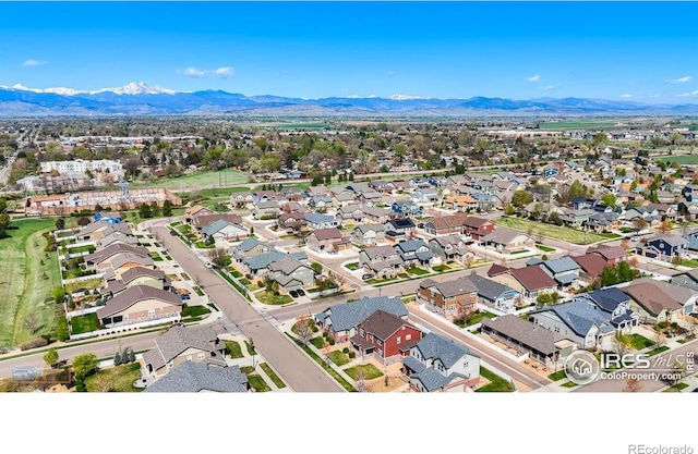 birds eye view of property featuring a mountain view and a residential view