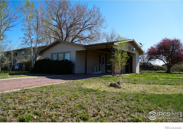 910 H Ave, Limon, CO 80828 - view of front of home with a front lawn and aphalt driveway
