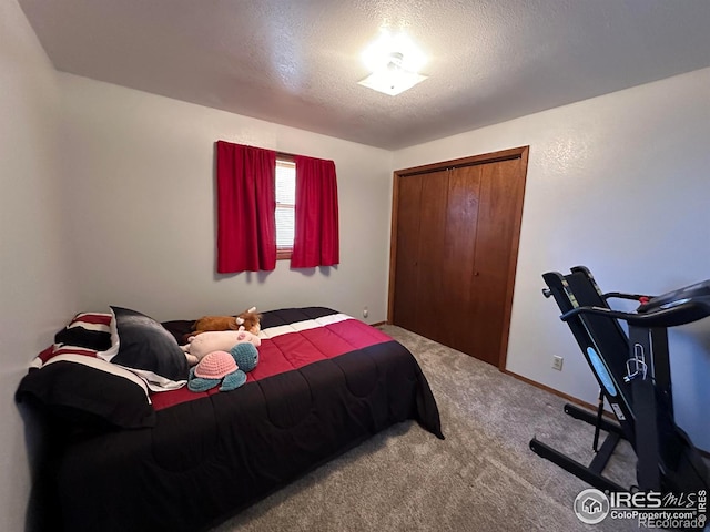 910 H Ave, Limon, CO 80828 - carpeted bedroom featuring a closet and a textured ceiling