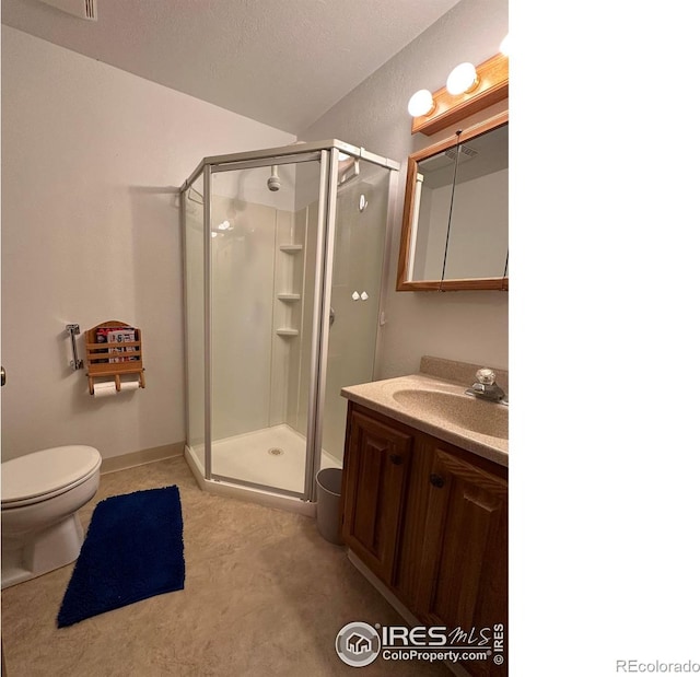 910 H Ave, Limon, CO 80828 - full bath featuring vanity, toilet, and a stall shower