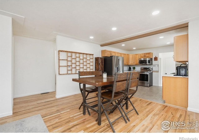 113 Balsam St, Fort Morgan, CO 80701 - dining area with light wood-type flooring, recessed lighting, and baseboards