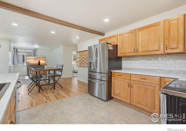 113 Balsam St, Fort Morgan, CO 80701 - kitchen with recessed lighting, backsplash, stainless steel refrigerator with ice dispenser, and electric range