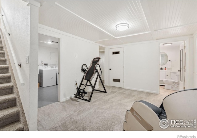 113 Balsam St, Fort Morgan, CO 80701 - workout area with light colored carpet, baseboards, visible vents, and washing machine and dryer