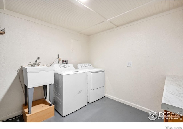 113 Balsam St, Fort Morgan, CO 80701 - washroom featuring baseboards, laundry area, and washer and clothes dryer