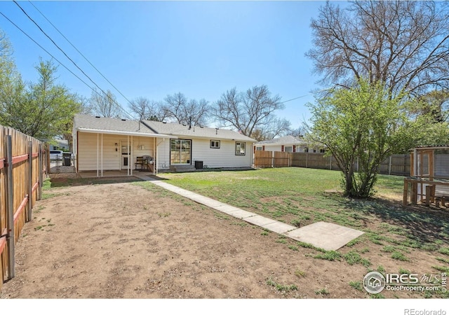 113 Balsam St, Fort Morgan, CO 80701 - back of property featuring a patio, a fenced backyard, and a yard