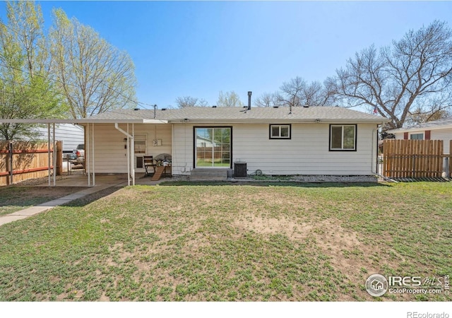 113 Balsam St, Fort Morgan, CO 80701 - rear view of property featuring a patio, a lawn, fence, and cooling unit