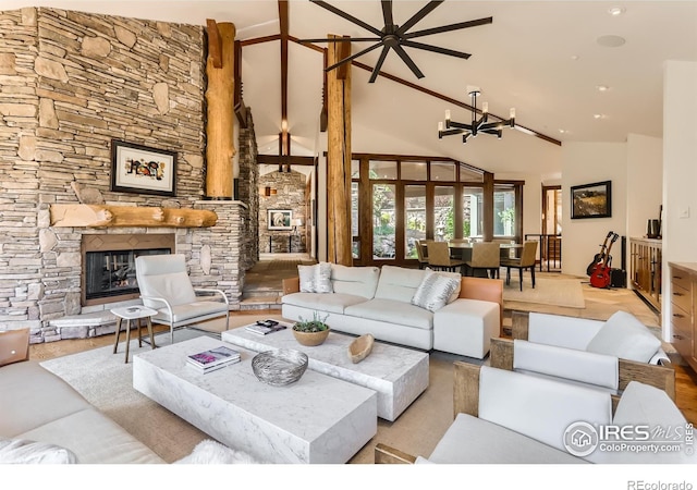 2307 Magnolia Dr, Nederland, CO 80466 - living room with high vaulted ceiling, an inviting chandelier, and a stone fireplace