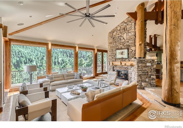 2307 Magnolia Dr, Nederland, CO 80466 - living area with a ceiling fan, a fireplace, and high vaulted ceiling