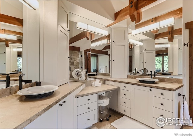 2307 Magnolia Dr, Nederland, CO 80466 - bathroom featuring vanity and beamed ceiling