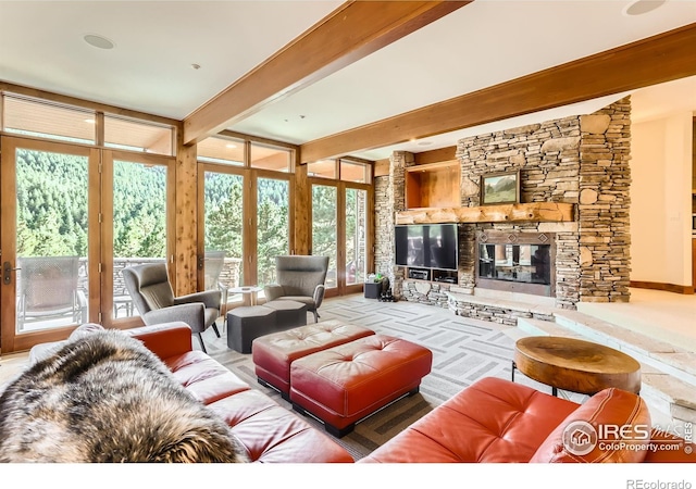 2307 Magnolia Dr, Nederland, CO 80466 - living area featuring a fireplace and beam ceiling