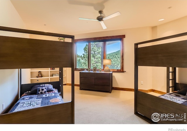 2307 Magnolia Dr, Nederland, CO 80466 - carpeted bedroom with baseboards and ceiling fan