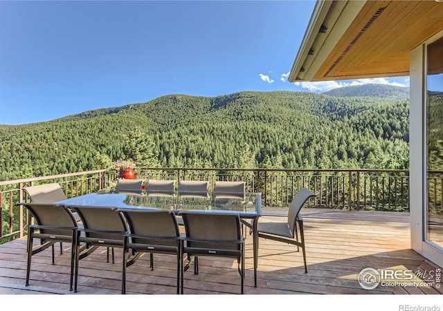 2307 Magnolia Dr, Nederland, CO 80466 - wooden terrace featuring a view of trees and a mountain view