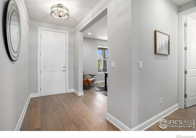 3295 Heron Lakes Pkwy, Berthoud, CO 80513 - foyer featuring recessed lighting, baseboards, and wood finished floors