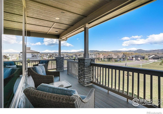 3295 Heron Lakes Pkwy, Berthoud, CO 80513 - wooden deck featuring a residential view and a mountain view