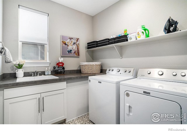 3295 Heron Lakes Pkwy, Berthoud, CO 80513 - clothes washing area featuring separate washer and dryer, a sink, and cabinet space