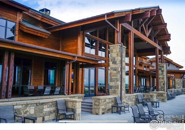 3295 Heron Lakes Pkwy, Berthoud, CO 80513 - rear view of property featuring a patio and a chimney
