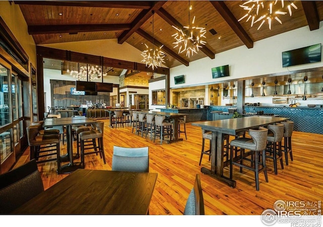 3295 Heron Lakes Pkwy, Berthoud, CO 80513 - dining room featuring wood ceiling, wood finished floors, a notable chandelier, and beam ceiling