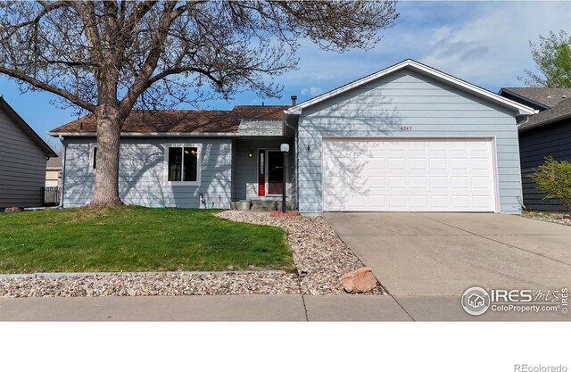 single story home featuring a garage, driveway, and a front lawn