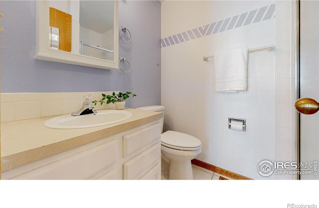 full bath featuring toilet and vanity