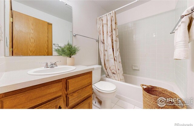 bathroom with toilet, shower / bath combination with curtain, tile patterned flooring, and vanity
