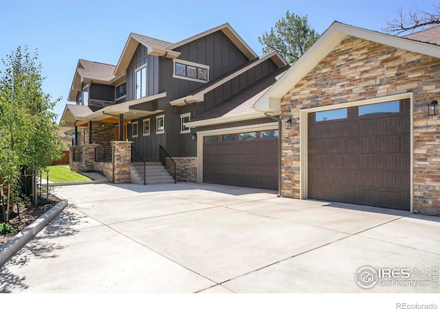 craftsman house featuring board and batten siding, a garage, concrete driveway, a shingled roof, and stone siding