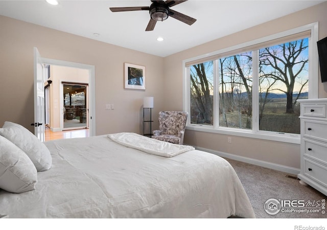 bedroom with recessed lighting, baseboards, light carpet, and ceiling fan