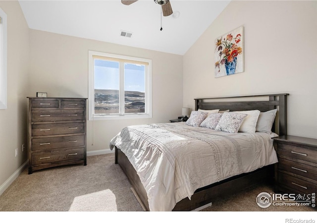 bedroom with a ceiling fan, light colored carpet, visible vents, vaulted ceiling, and baseboards