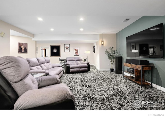 carpeted living area with recessed lighting, baseboards, and visible vents