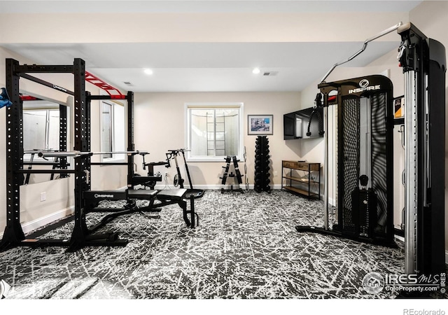 exercise area with recessed lighting, baseboards, and visible vents