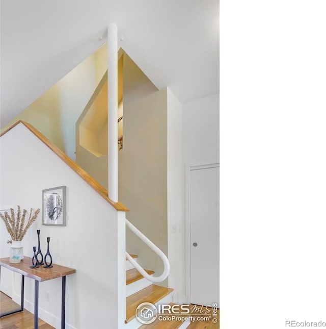 1025 Neon Forest Cir, Longmont, CO 80504 - stairs featuring wood finished floors