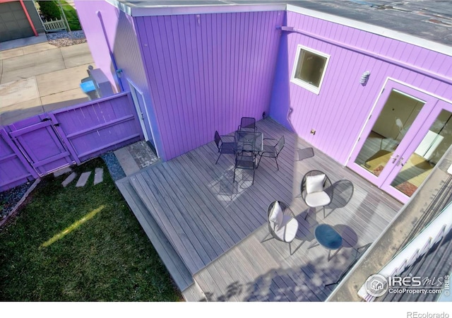 1025 Neon Forest Cir, Longmont, CO 80504 - wooden deck featuring french doors and outdoor dining space