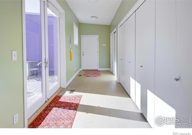 1025 Neon Forest Cir, Longmont, CO 80504 - hall with french doors and baseboards