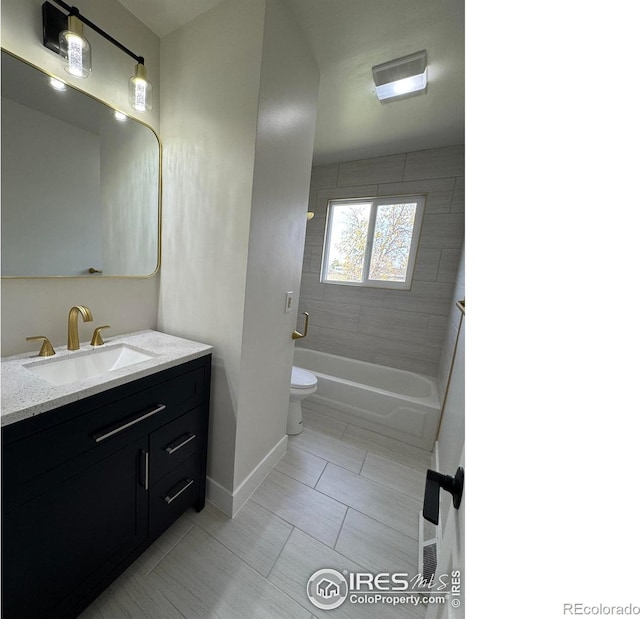 2221 E 84th Ave, Denver, CO 80229 - full bath featuring toilet, baseboards, vanity, bathtub / shower combination, and tile patterned floors