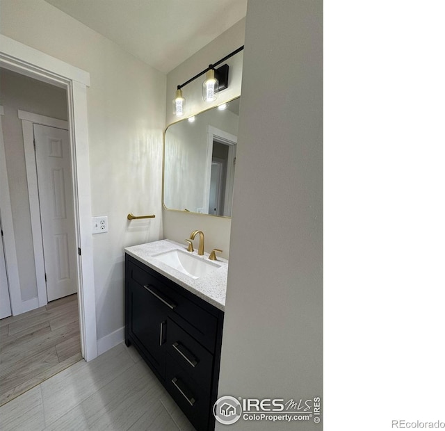 2221 E 84th Ave, Denver, CO 80229 - bathroom featuring vanity and baseboards